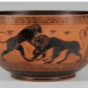 Bol en terre cuite à décor noir : deux lions affrontés, frises de rinceaux et de méandres.